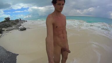 HARD UNDRESSED MAN WALKING AROUND A BEACH