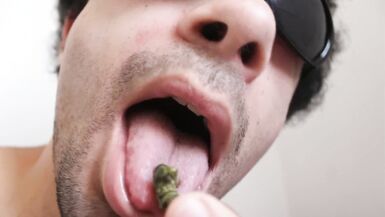 Naked boy licks a tiny guy and puts him in his butthole.