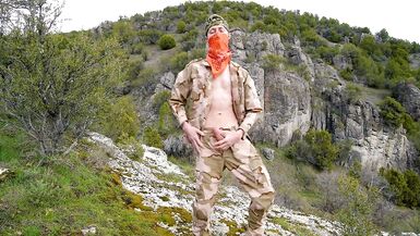 Soldier wanks himself on the mountainside on a warm spring day in the northern rocky mountains.