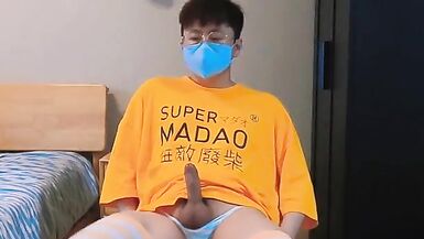 Boy in yellow t-shirt and stockings masturbates and cums at home