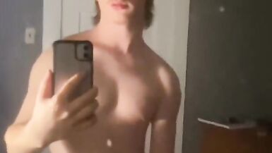 Hot guy with long hair jacks his duck off in the mirror