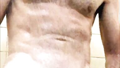 Dad takes a hot shower after a cold hike at the camp shower. - 11 image