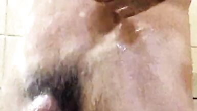 Dad takes a hot shower after a cold hike at the camp shower. - 5 image