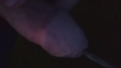 Boy pissing on highway parking lot