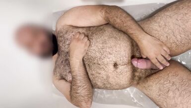 Extended: Uncut hung bear getting hard in the bathtub with slow motion cumshot
