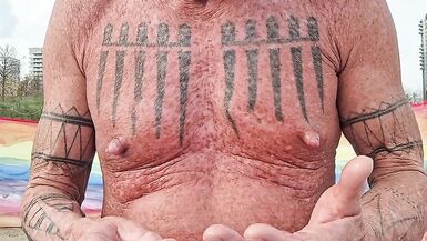 Playing with my nipples at the beach