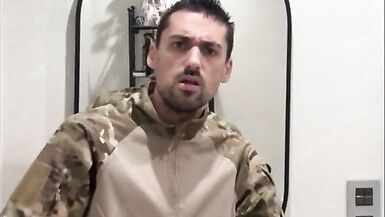 Military guy two hands jerks his meat