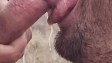 A Guy Gives a Blowjob to a Guy with a Big Cock Outdoors Until He Gives Him a Good Facial